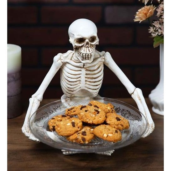 Sitting Skeleton Holding a Glass Plate