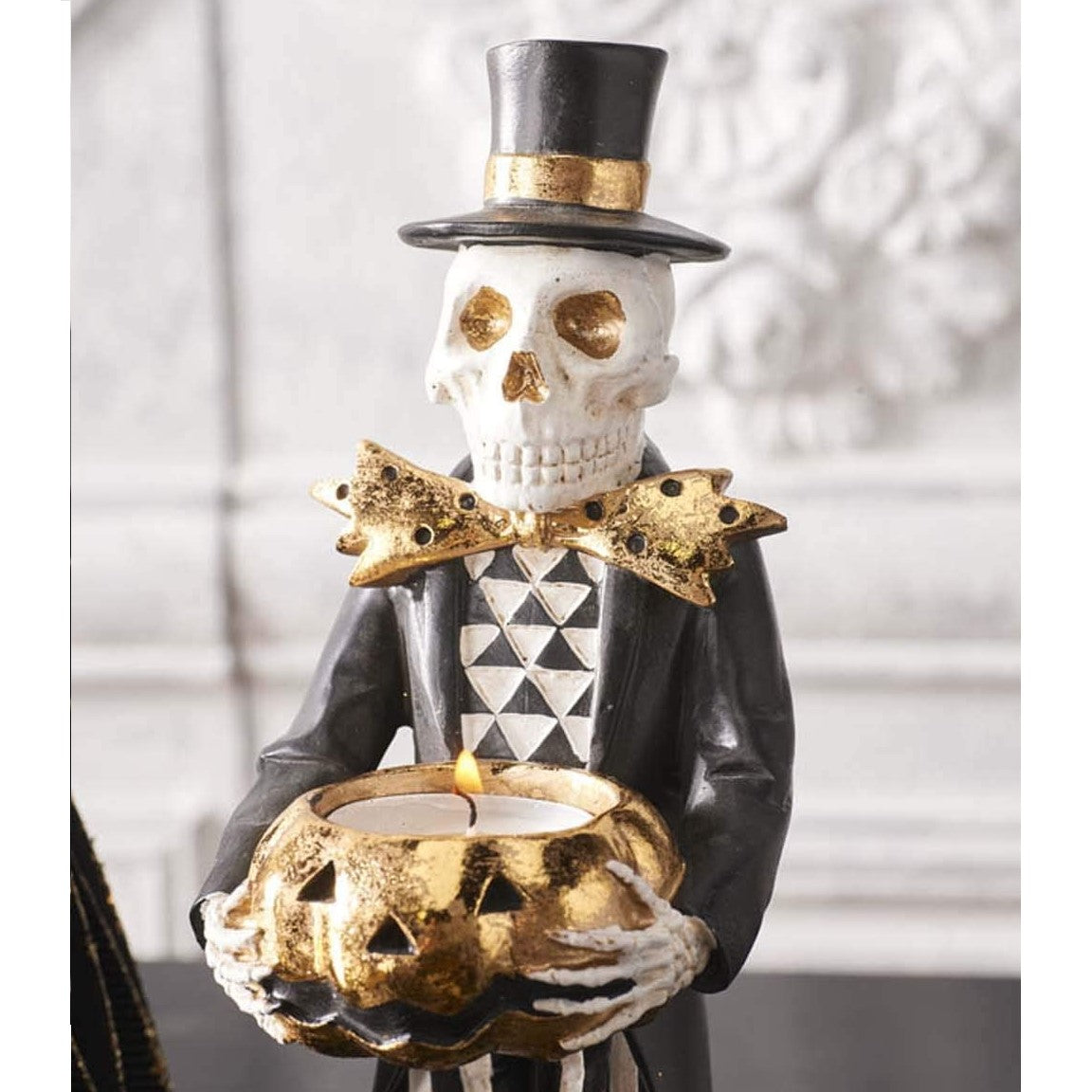 Skeleton Holding Gold Jack-O-Lantern Tealight Holder