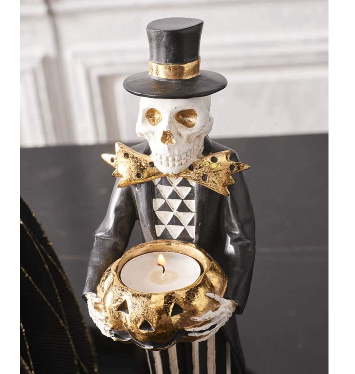 Skeleton Holding Gold Jack-O-Lantern Tealight Holder